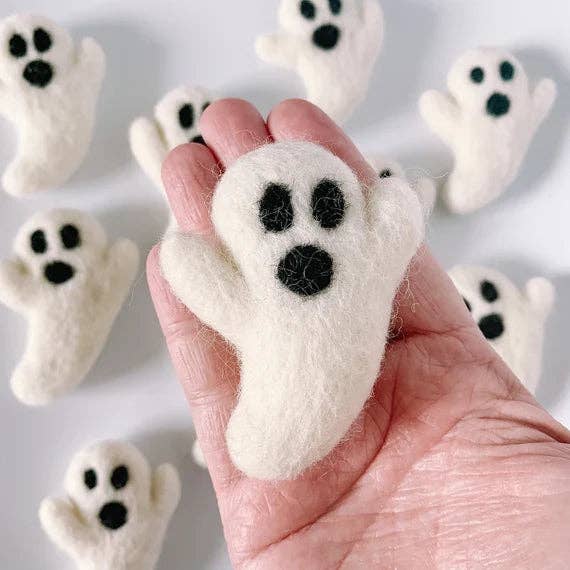 hand holding a felt ghost