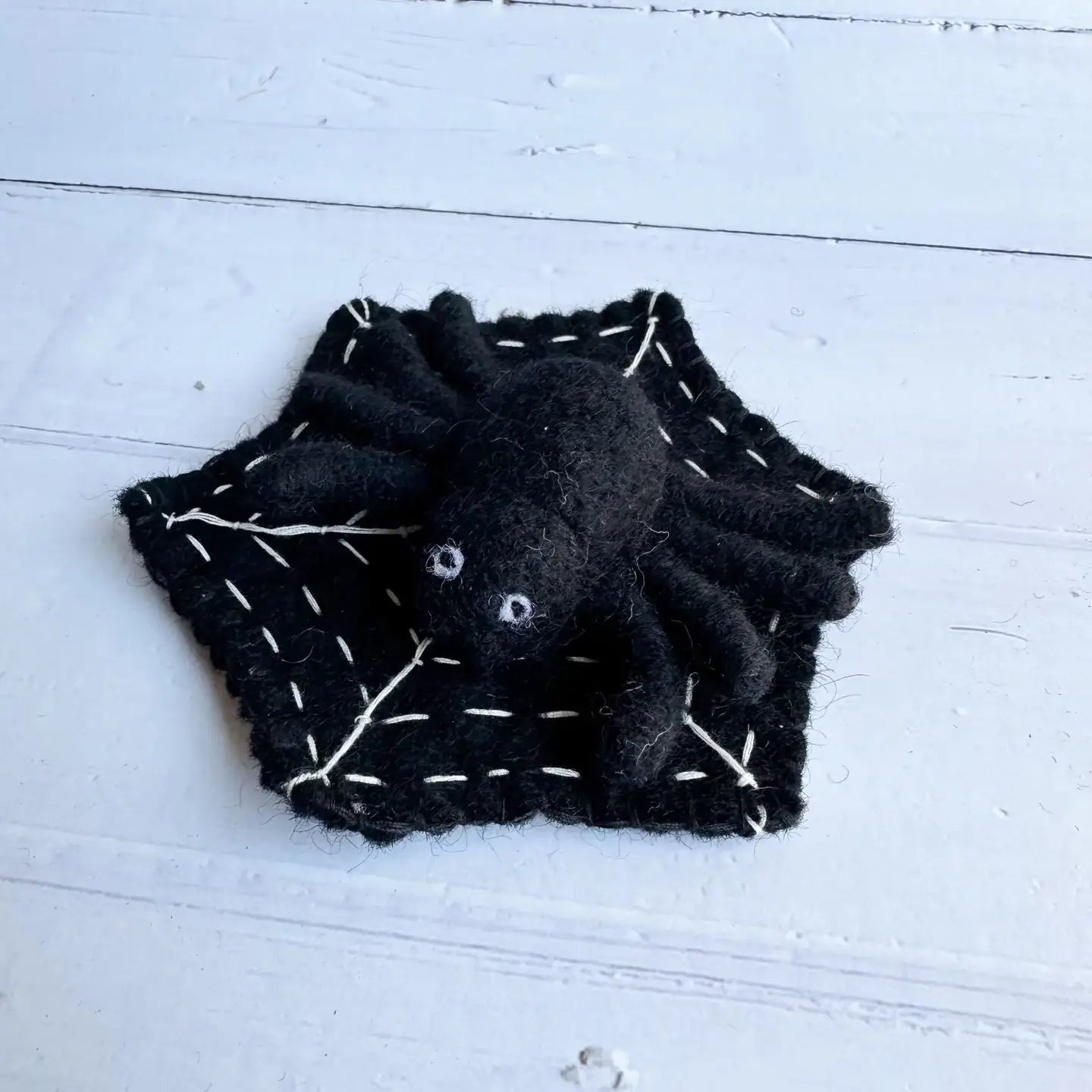 felt black spider on a felt black spider web