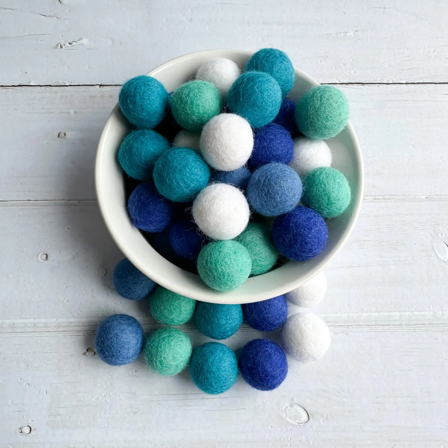 set of winter balls in a white bowl