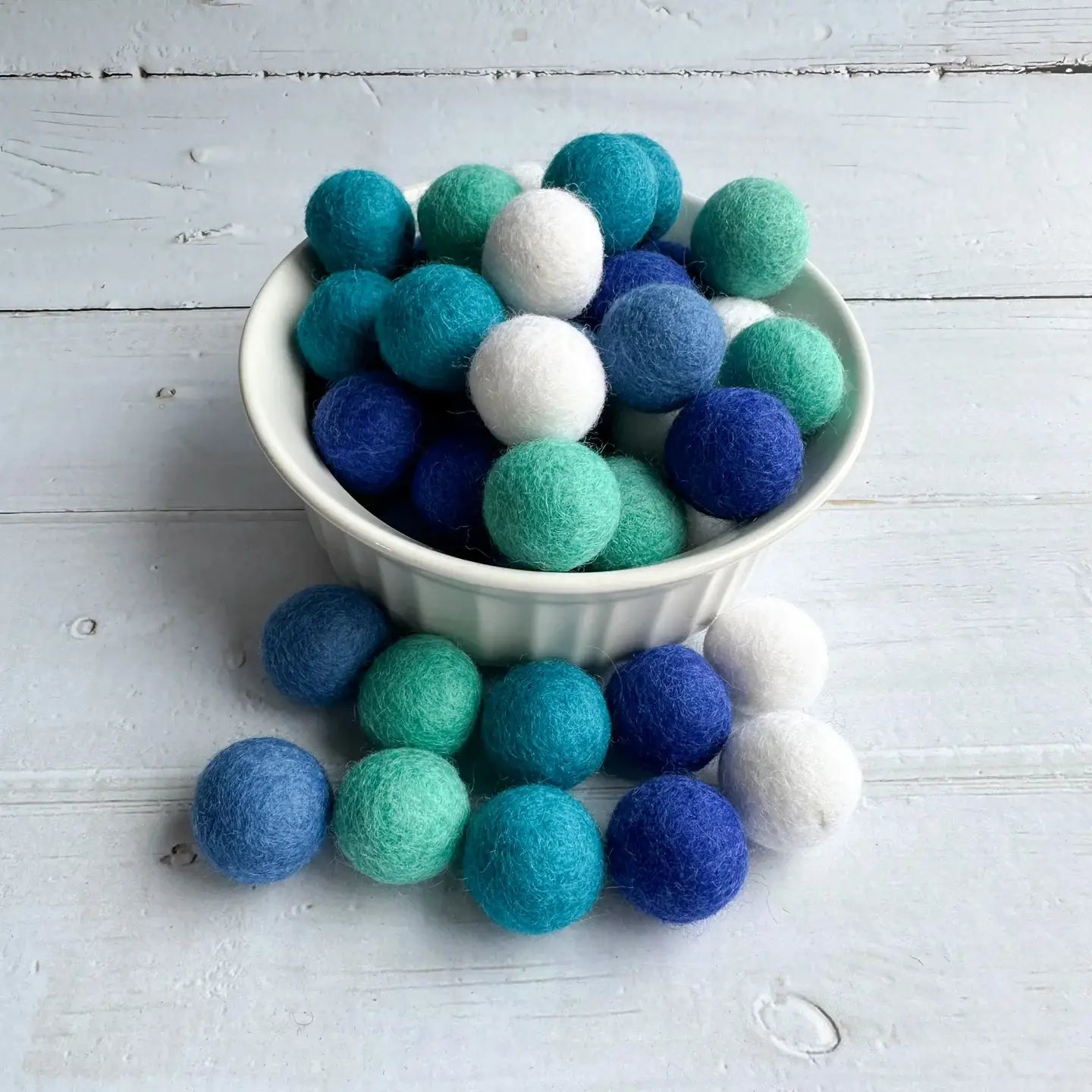 felt winter balls in a bowl