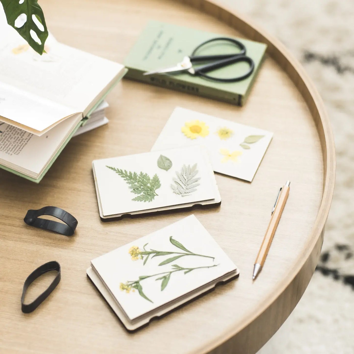 Opened pocket flower press with dried flowers