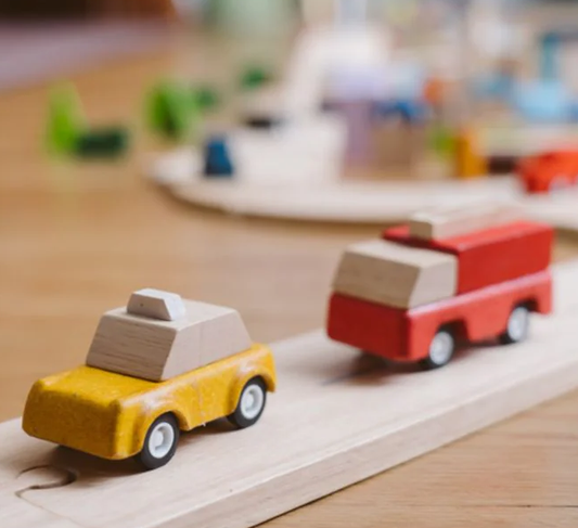 Plan Toys Yellow Taxicab and firetruck