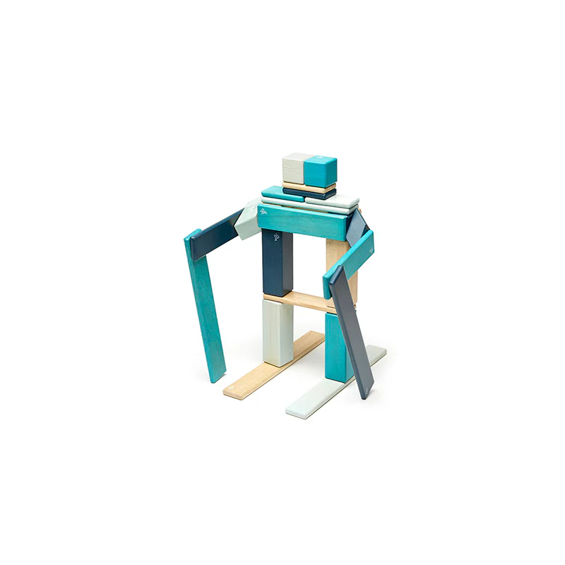 tegu 24-piece magnetic set in blues shaped like a skier