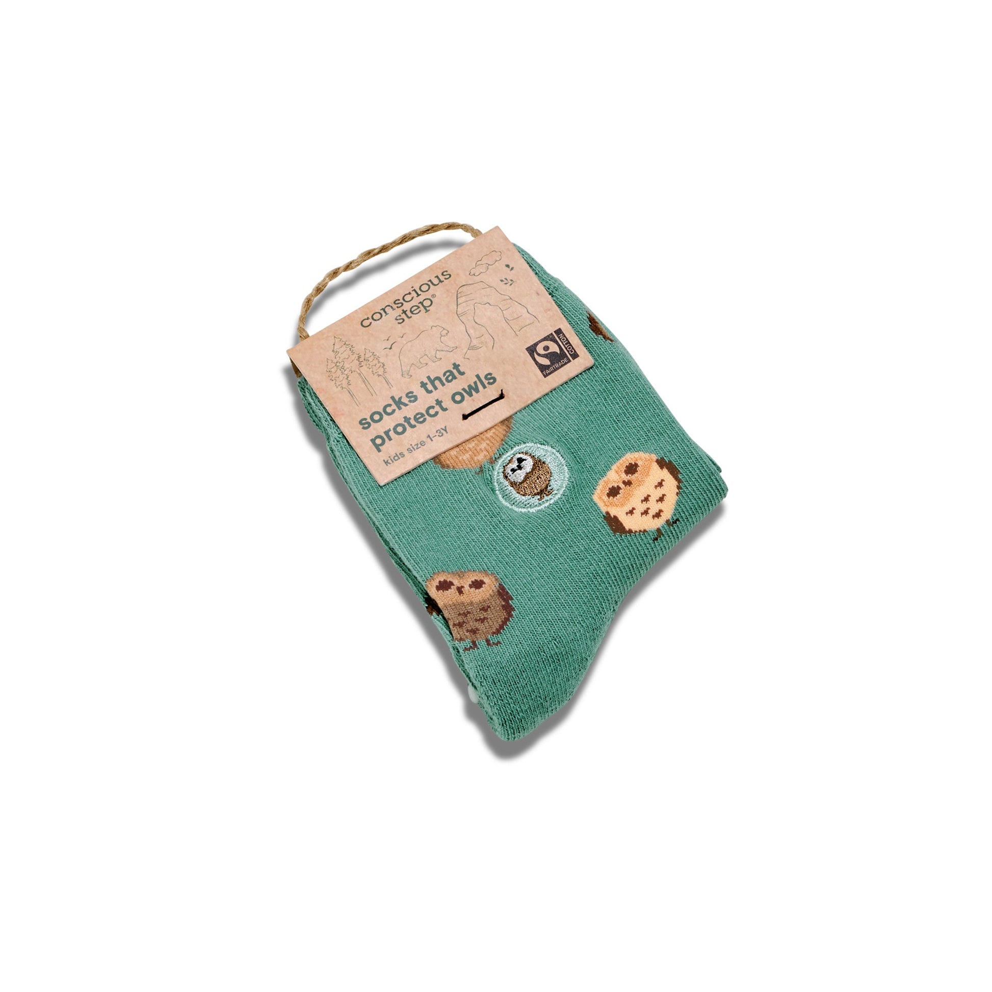 Green socks with owl design on a white background