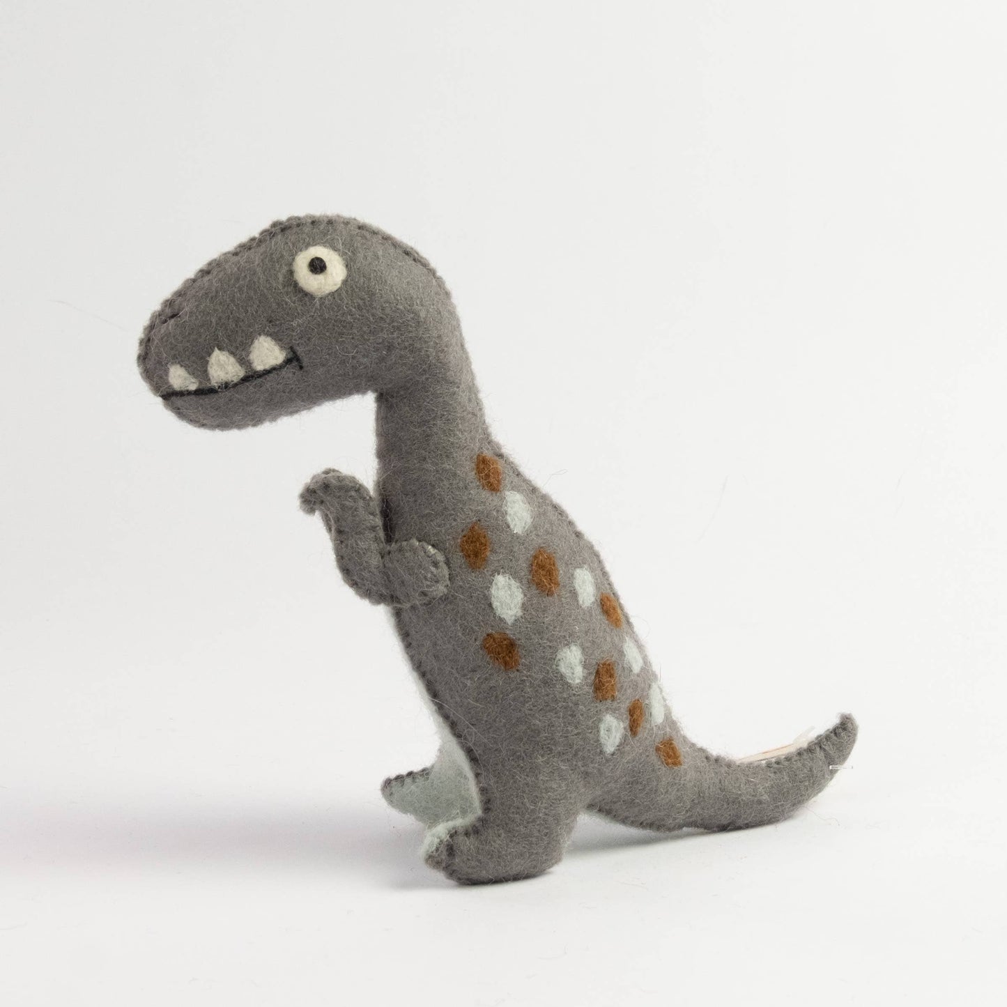 Gray dinosaur plush toy with brown and white spots on a light gray background
