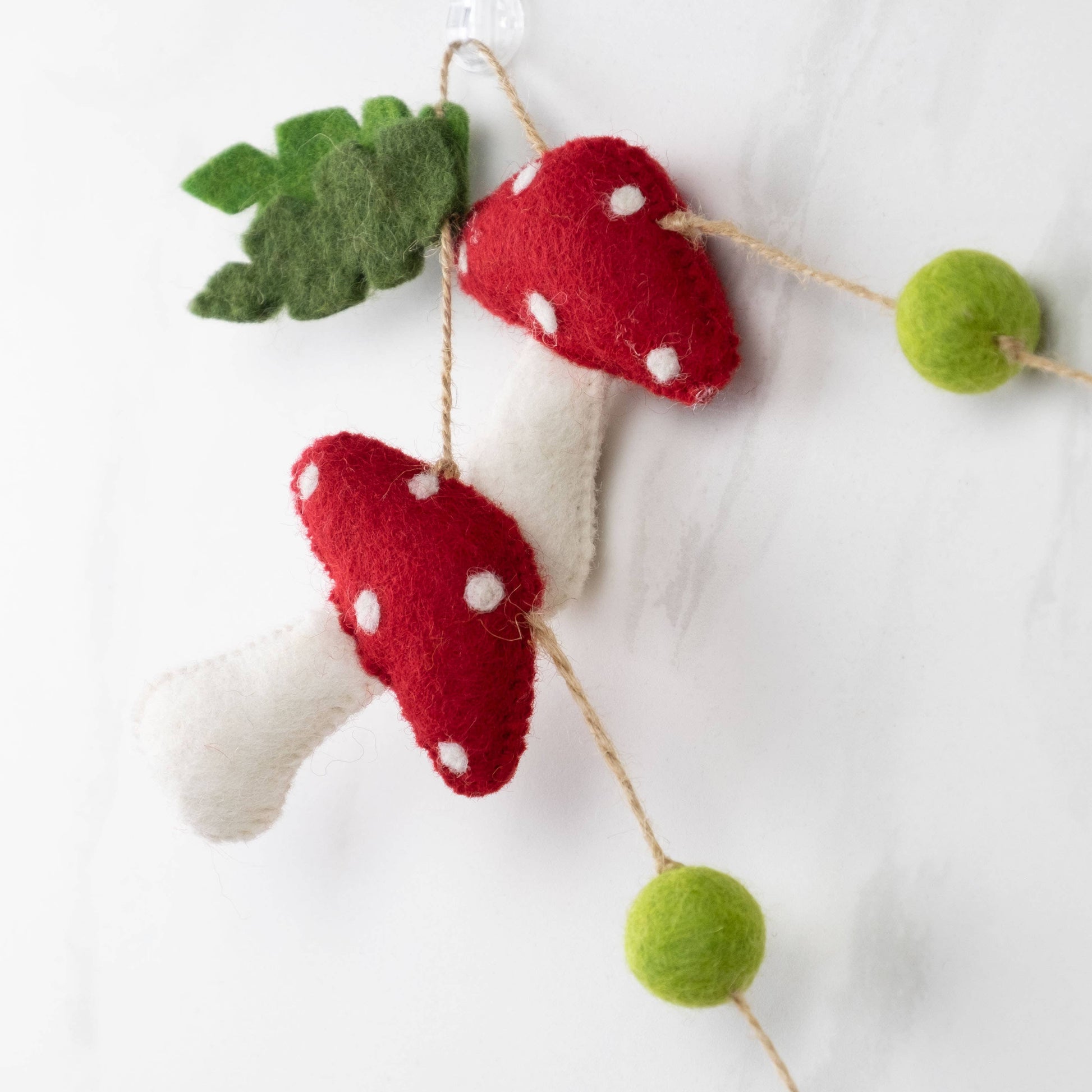 Detail of red spotted mushroom garland