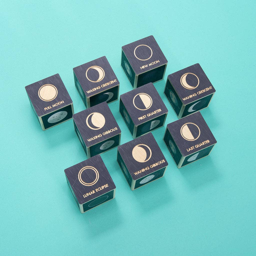 Blue dice with moon phase symbols on a teal background