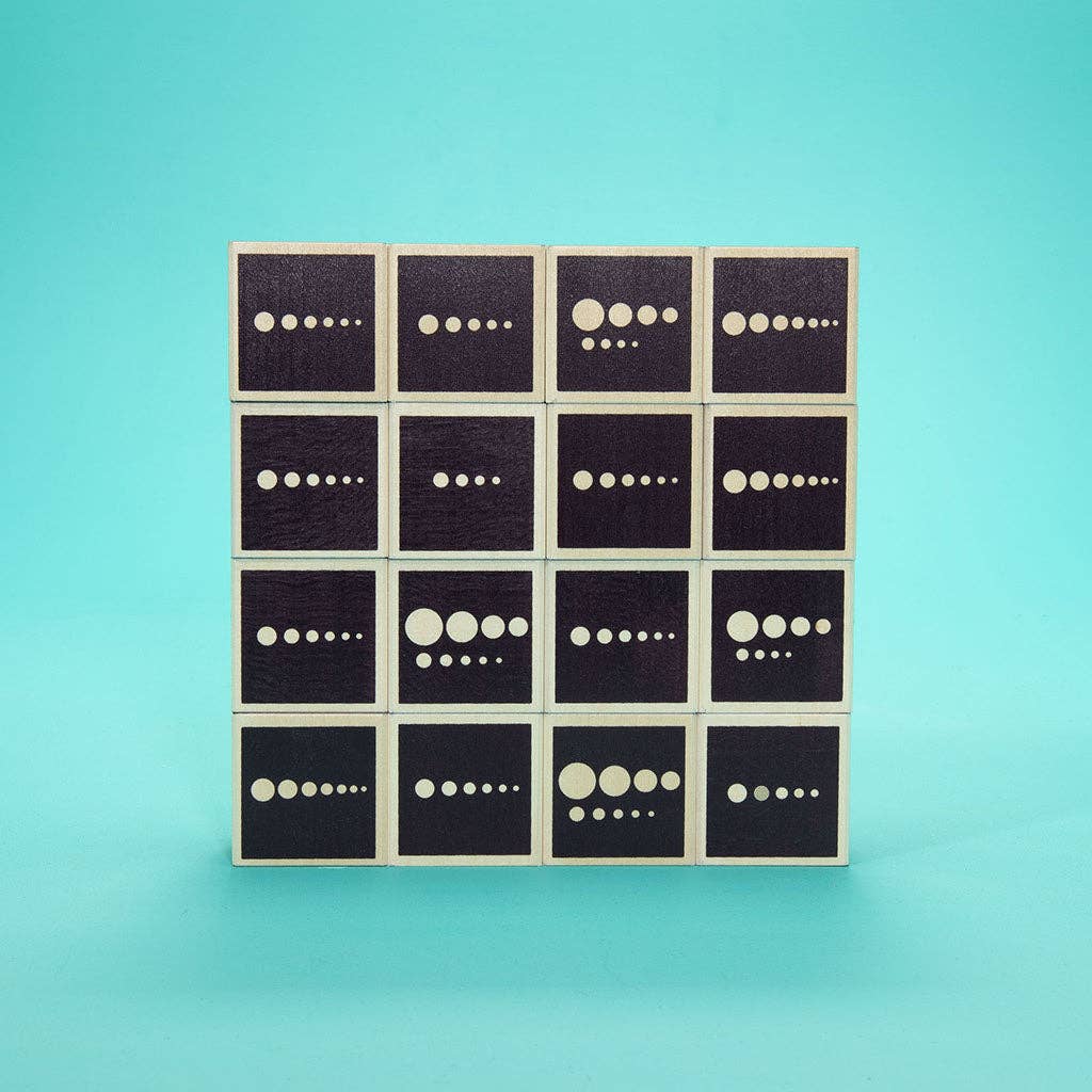 Grid of black blocks with white dot patterns on a teal background