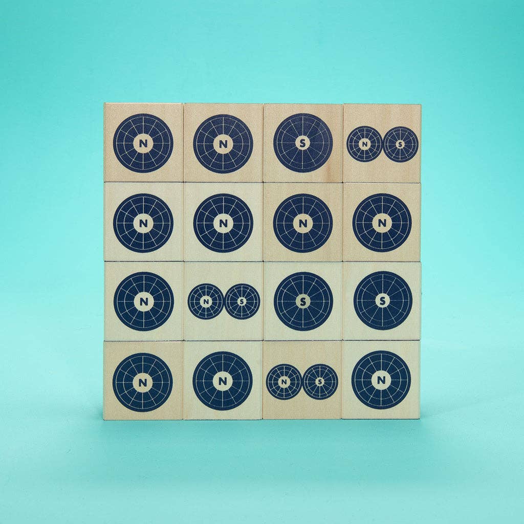 Wooden blocks with compass designs on a blue background