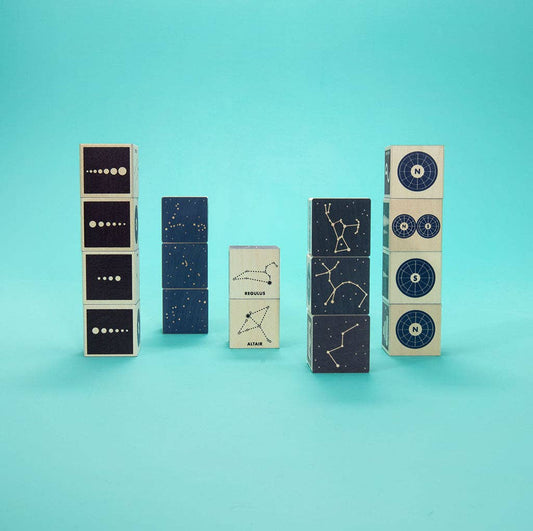 Stackable blocks with star constellations and zodiac signs on a teal background