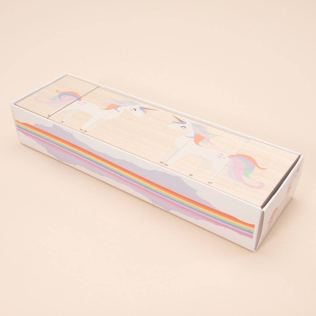 Box with unicorn blocks and rainbow design on a beige background