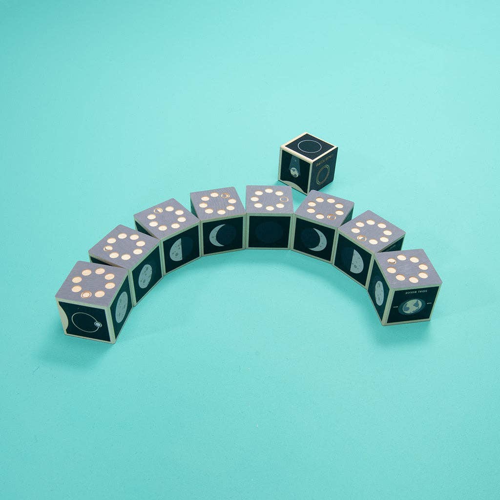 Blocks with moon phases arranged in a semi-circle on a teal background