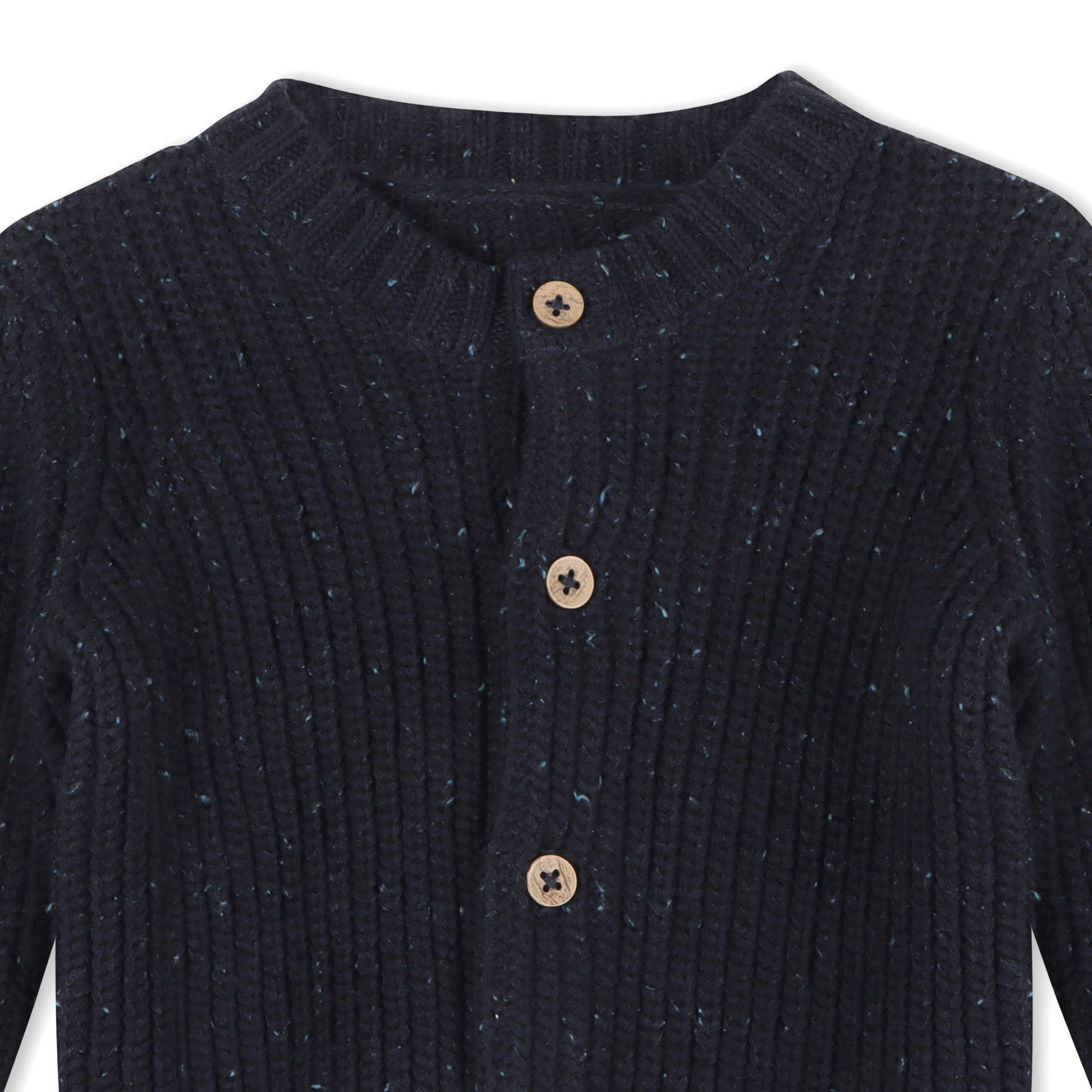 Navy blue ribbed sweater with wooden buttons on a white background