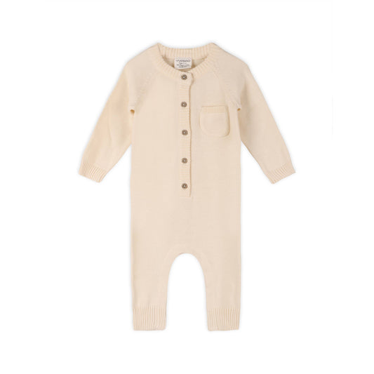 Cream baby romper with buttons on a white background
