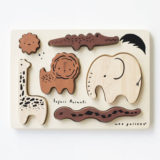 Wooden puzzle with animal shapes on a white background