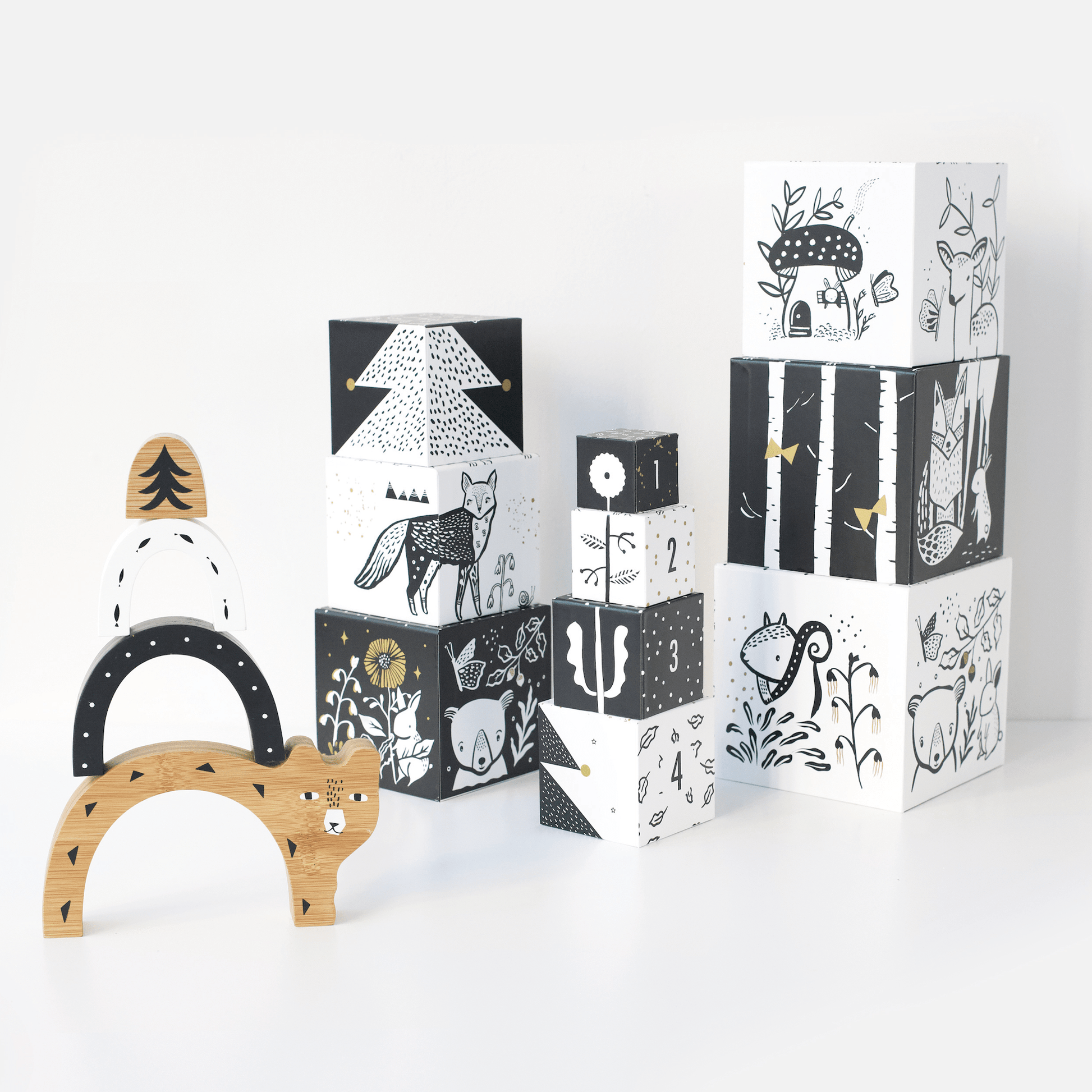 Wooden toys with animal illustrations on a white background