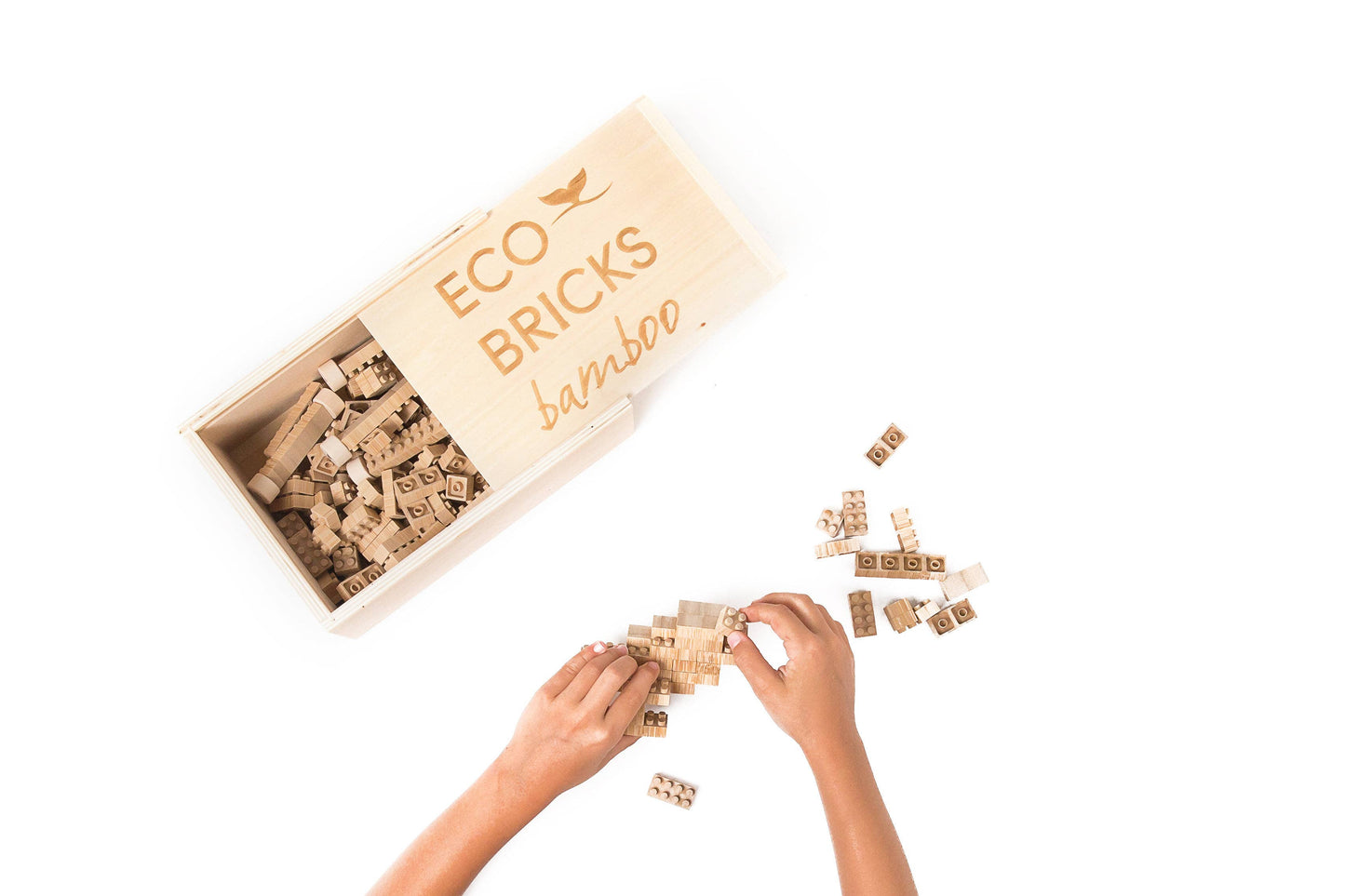 Kid building a structure with pieces from the Bamboo Eco-Bricks 250-piece set