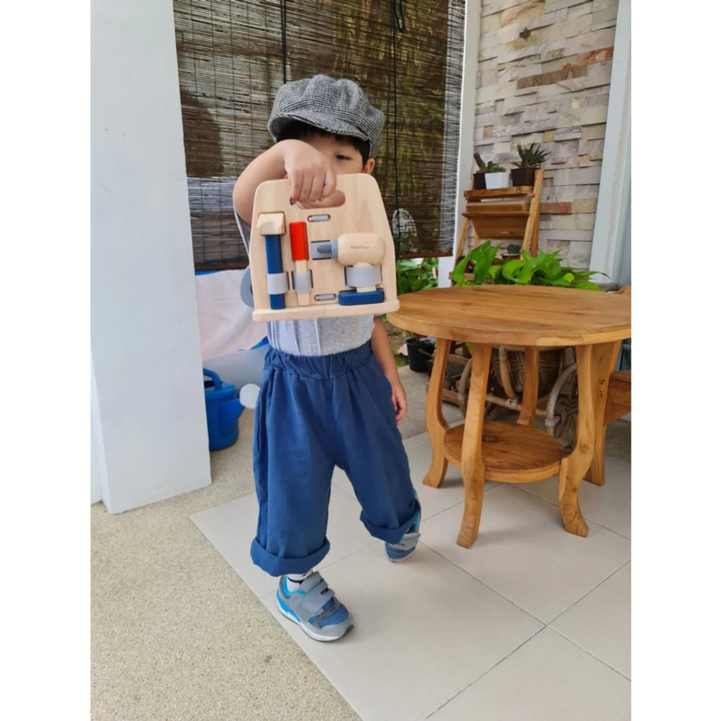 Child with Handy Carpenter Set