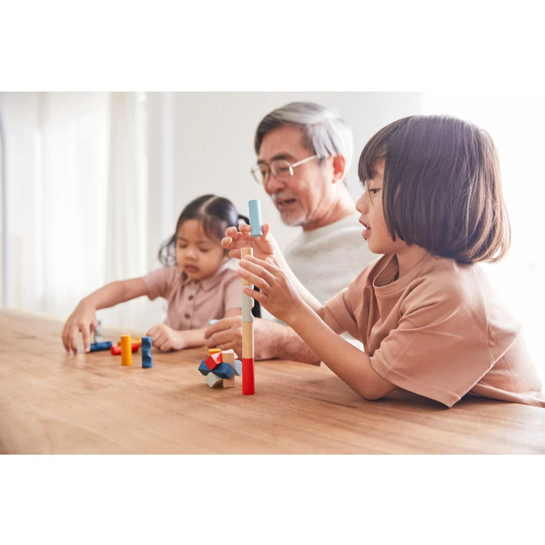 Family playing with PlanMini 3D puzzles