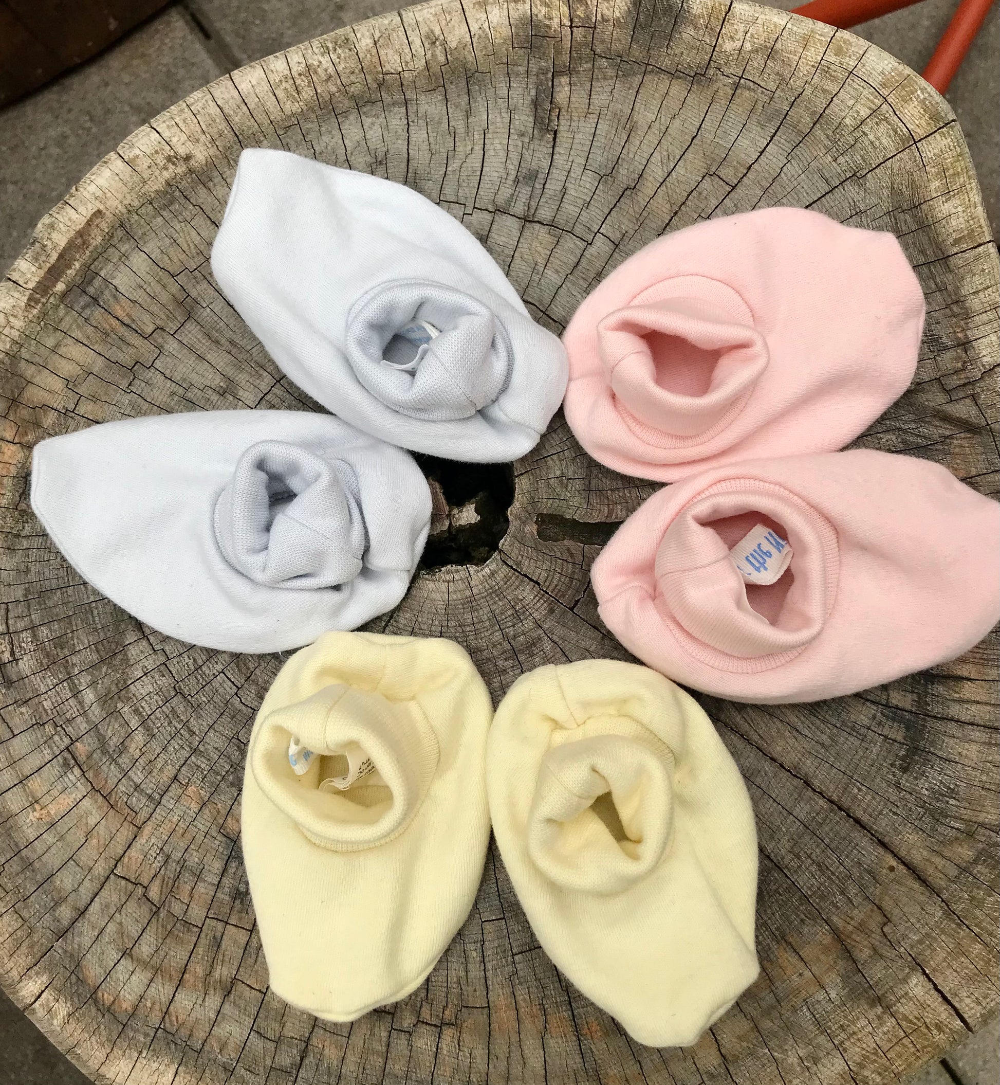 three pairs of Organic Cotton Booties by under the nile in a circle