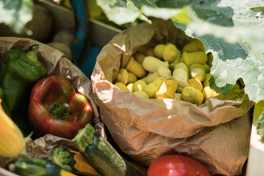 Tulip Mandala in a paper bag in a crate of veggies