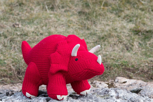 soft red knitted triceratops toy