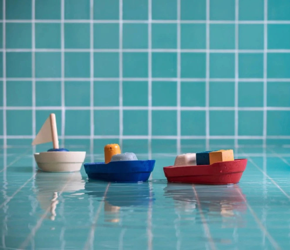 Sustainable boats for bath or water. Tugboat or Sailboat from plan toys made from natural rubber and rubber wood