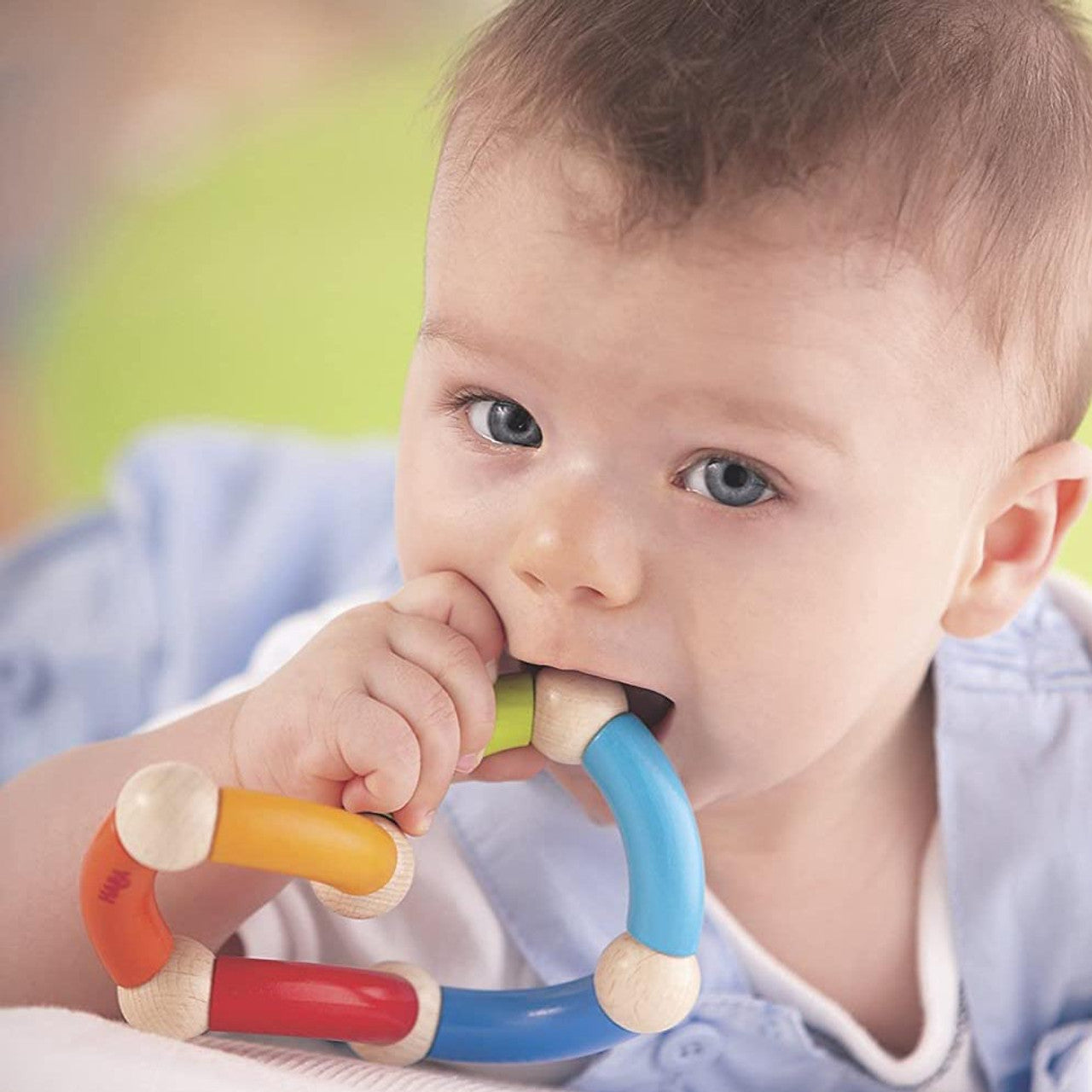 Baby chewing on Haba Color Snake Teether