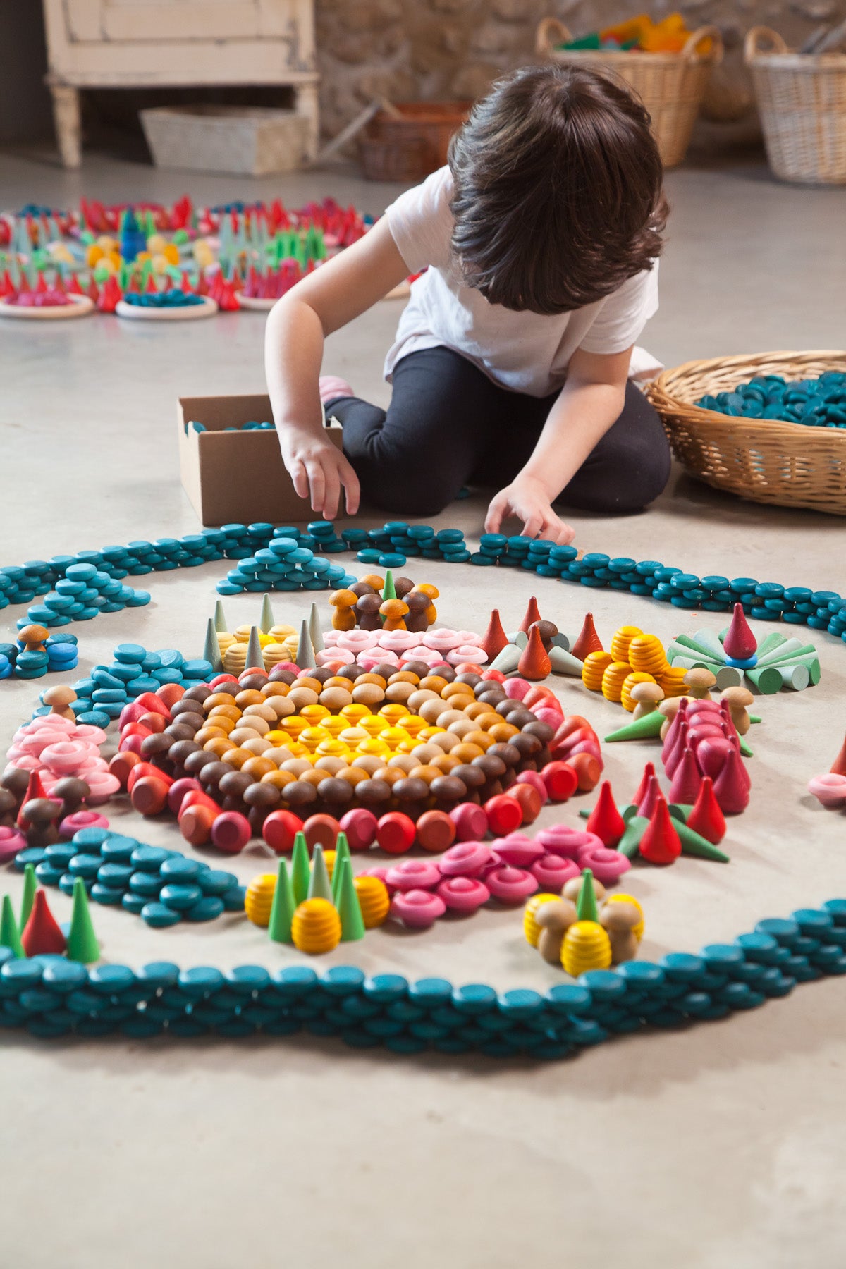 Child playing with all Grapat Mandalas