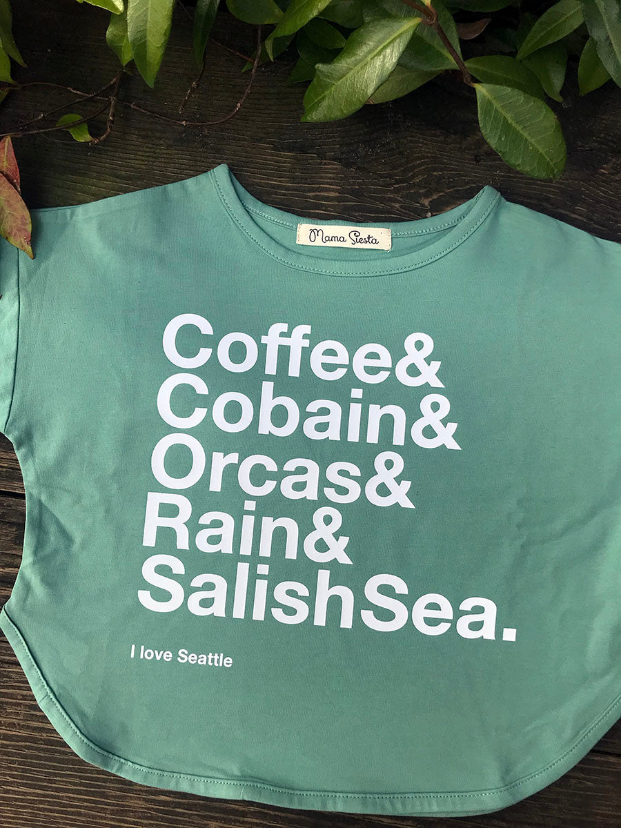 The Organic Seattle Cropped Tee in Aqua with white print