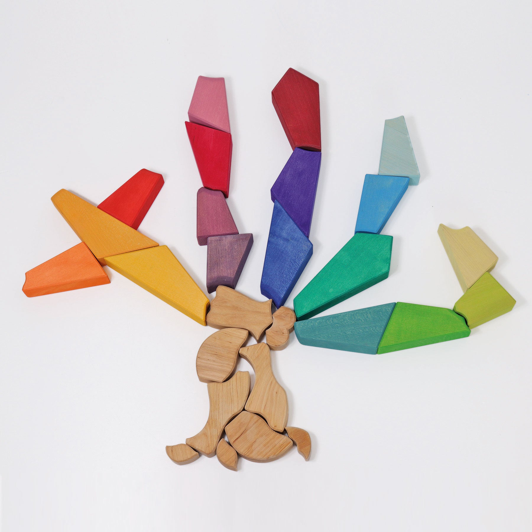 Pieces from rainbow lion puzzle arranged into a tree shape