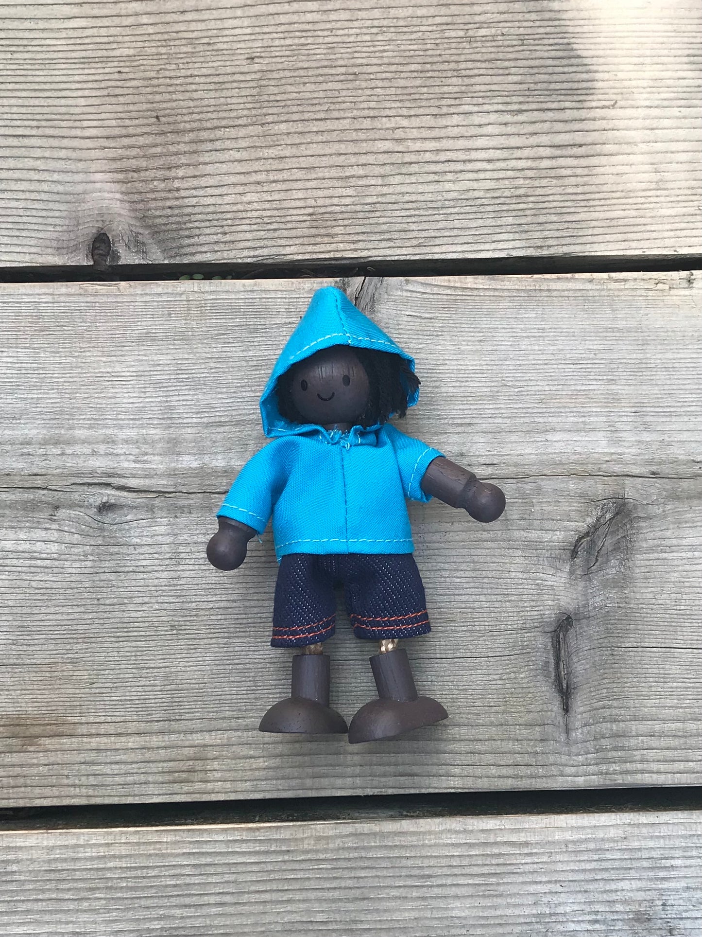 plan toys doll in a blue Hoodie