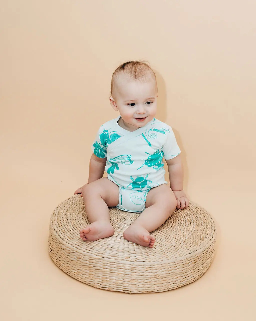 Baby wearing bug bodysuit