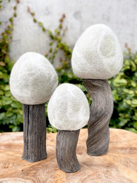 Winter wool felt trees with dark trunks