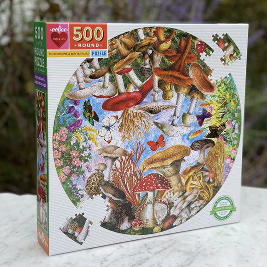 Mushroom and Butterflies 500 Puzzle in a box on a table outside