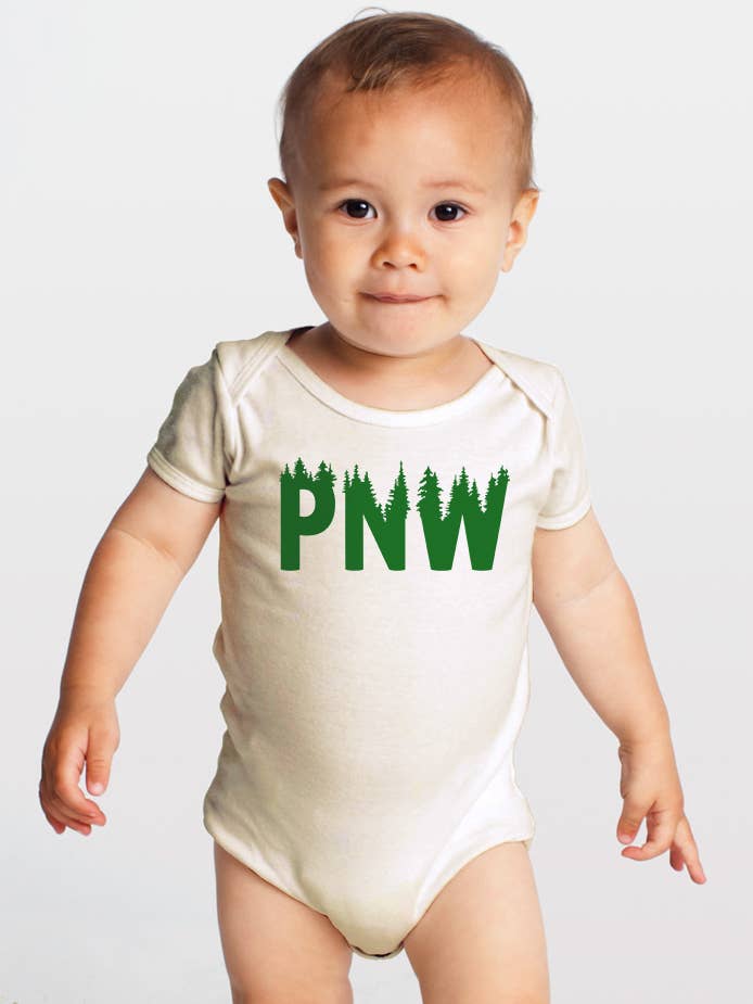 baby wearing PNW trees organic baby onesie