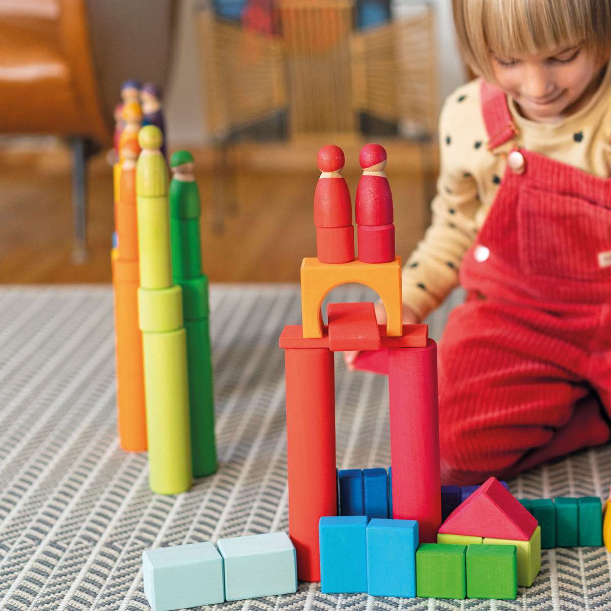 Large Rainbow Building Rollers play with people and blocks