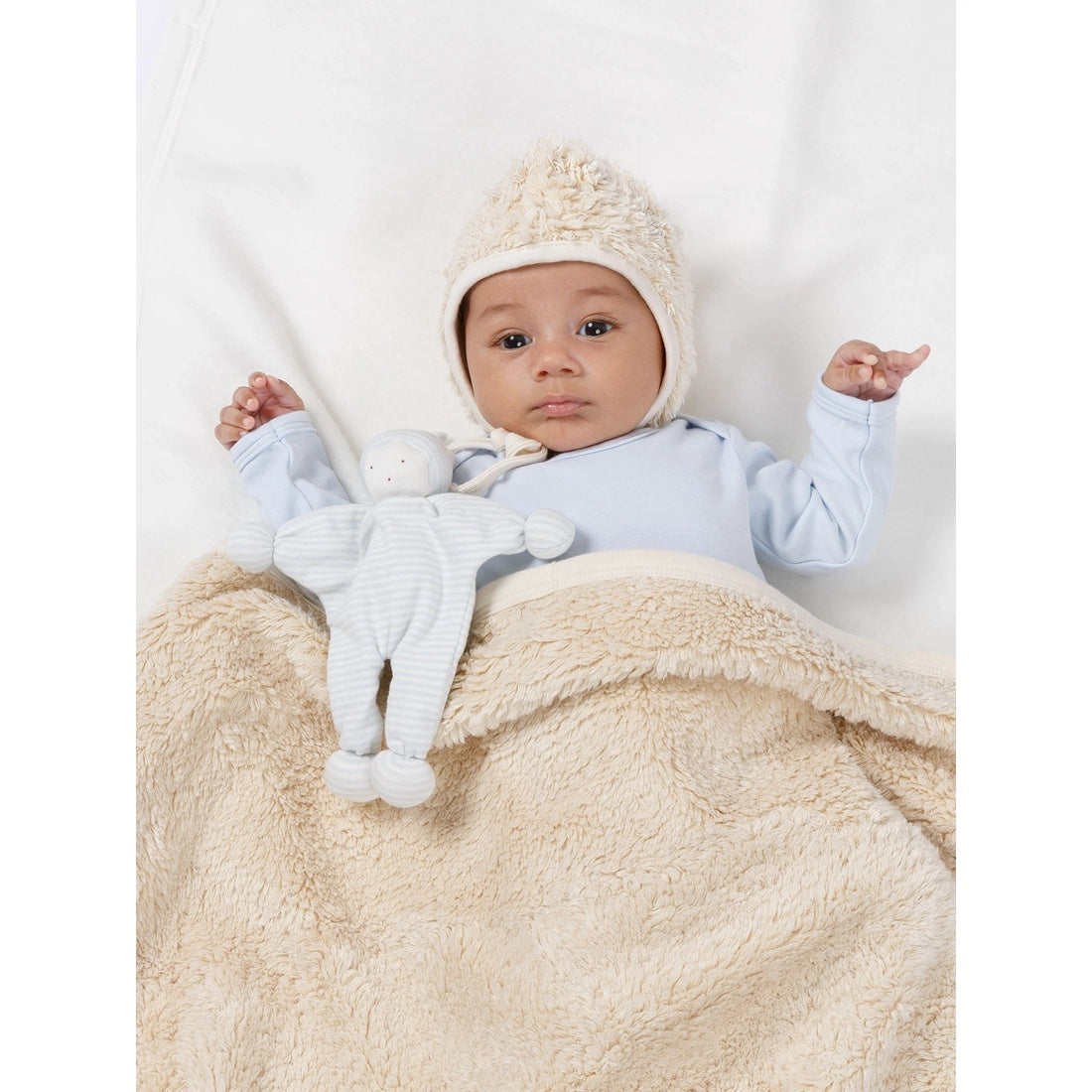 Baby wearing an Organic Faux Fur Sherpa Bonnet Hat