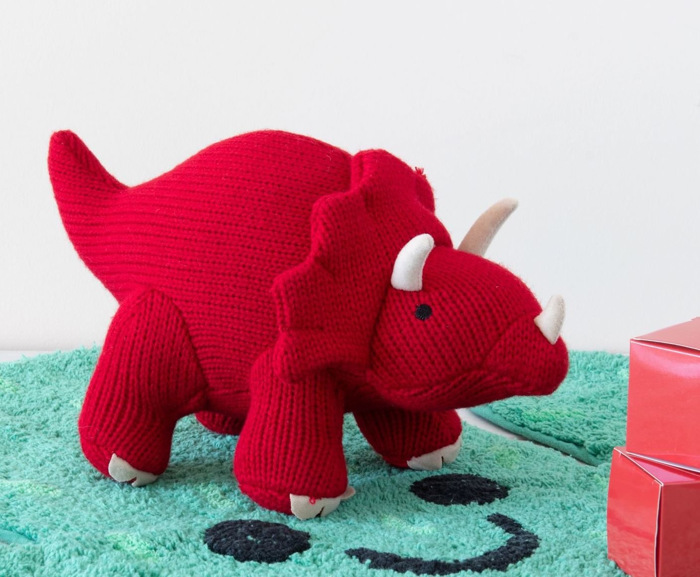 soft red knitted triceratops