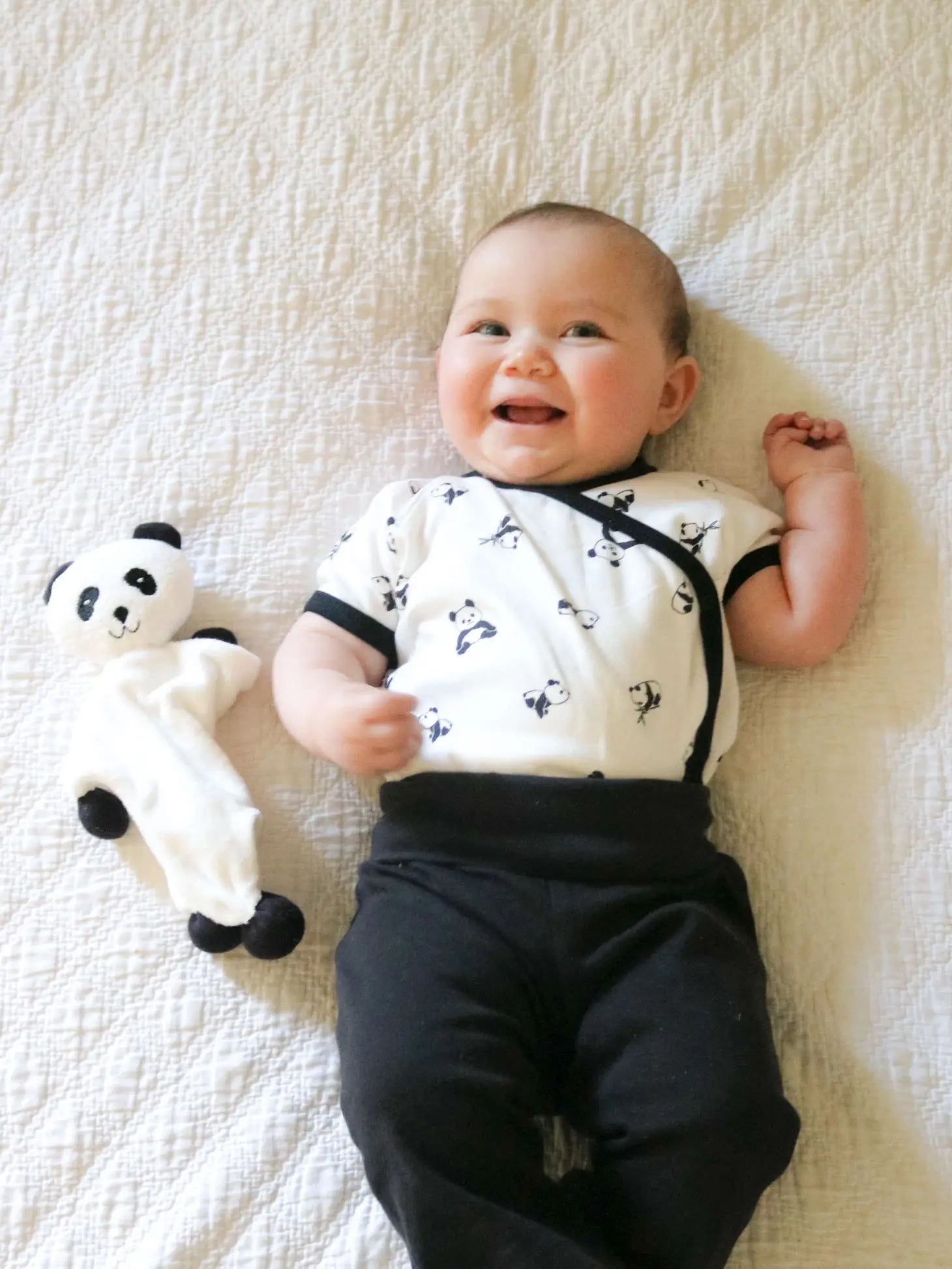 Baby wearing short sleeve panda onesie
